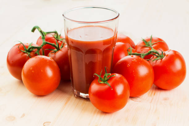 istock Glass of tomato juice with tomatoes 1126073913