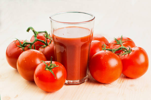 istock Glass of tomato juice with tomatoes 1126073927