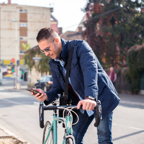 istock Businessman using a phone in city 1126074319