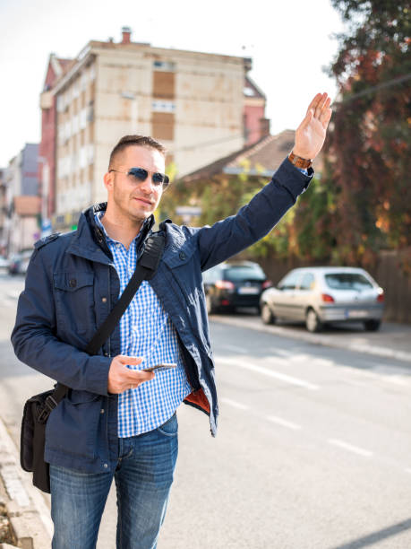 istock Businessman Hailing Taxi 1126074337