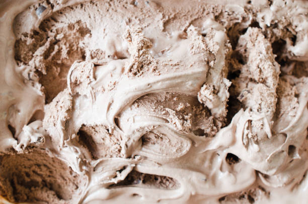 istock Texture of melting chocolate ice cream. Brown background. 1126074466