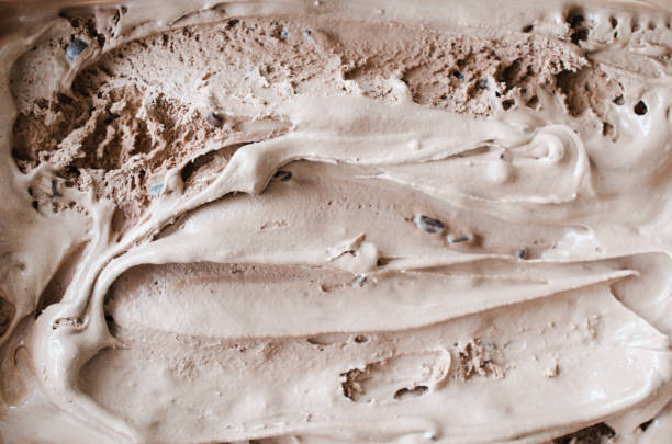 istock Texture of melting chocolate ice cream. Brown background. 1126074477