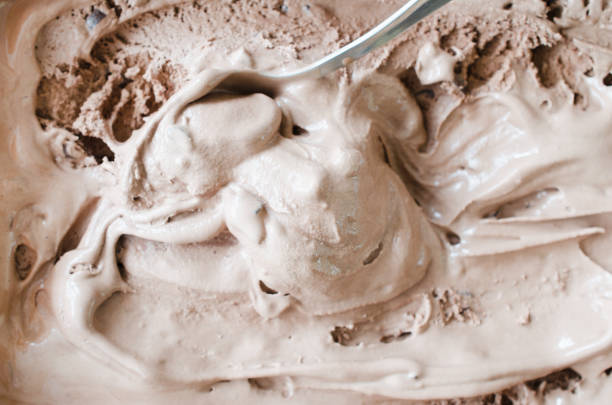 istock Texture of melting chocolate ice cream. Brown background. 1126074615