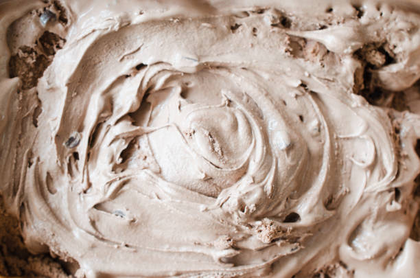 istock Texture of melting chocolate ice cream. Brown background. 1126074621