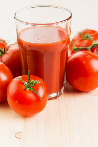 istock Glass of tomato juice with tomatoes 1126074632