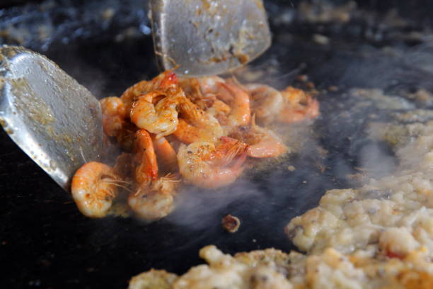 Thai street food. Mussel omelette, add the eggs and mix well