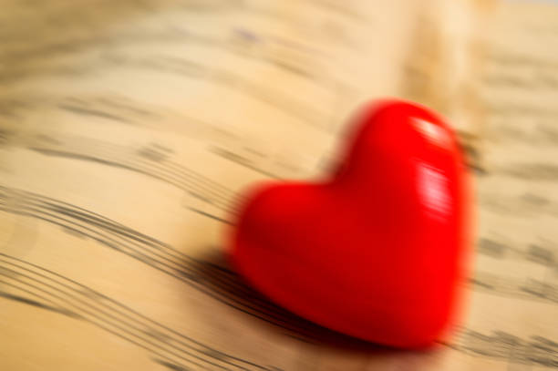 istock heart lies on the background of notes, blurred background. 1126075938