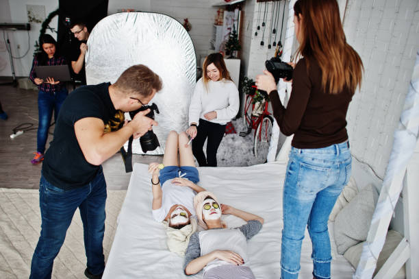 istock Work process of team photographer, designers and models stuff on photosession, master class of proffesionals. 1126075955