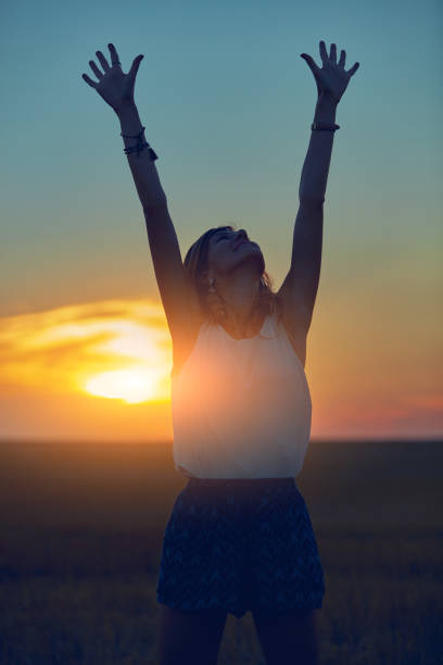 istock Cute young woman jumping in a wheat field. 1126076041