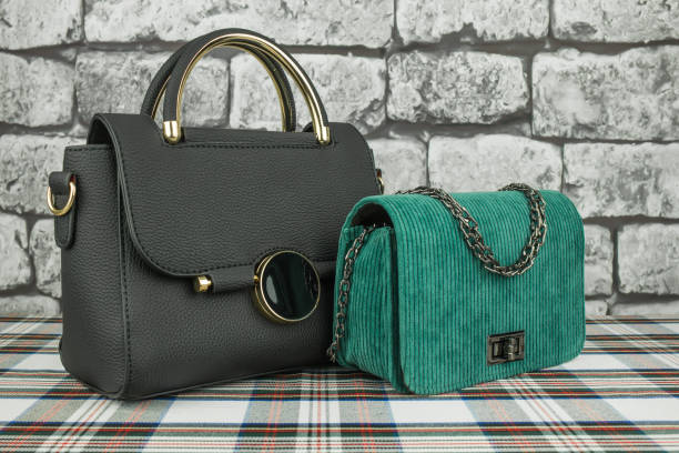 istock Black bag and green clutch right 1126076179