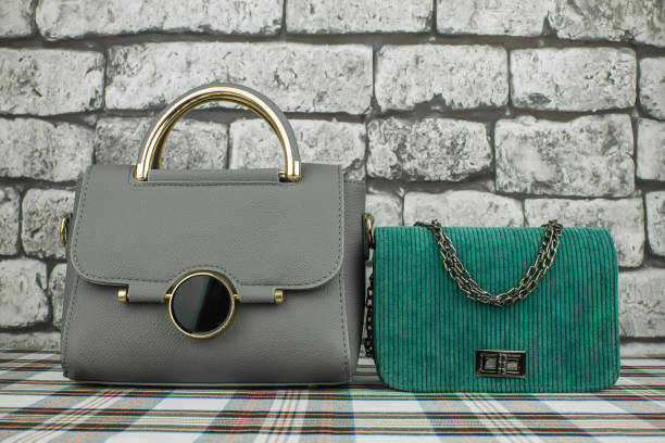 istock Gray bag and green clutch 1126076186