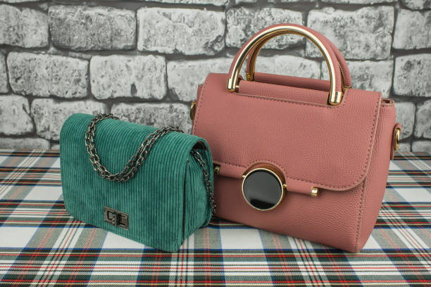 istock Pink bag and green clutch left 1126076242