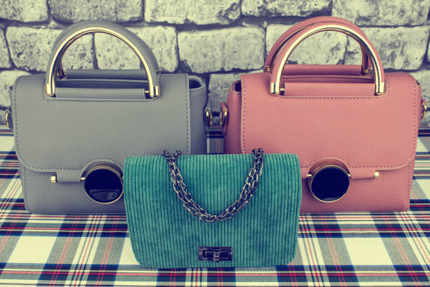 istock Gray, pink bag and green clutch 1126076265