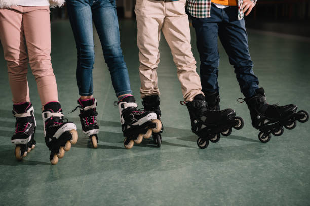 istock Partial view of children legs in roller skates 1126078193