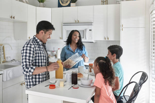 istock Happy family having breakfast at home 1126081180