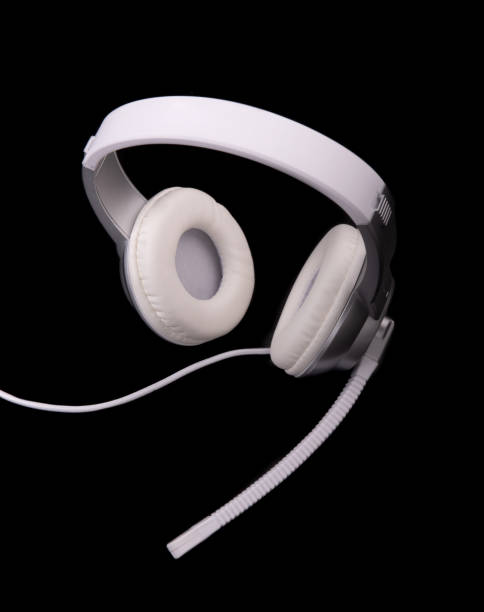 istock White headphones with a microphone for playing on a black background 1126081295