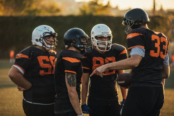 istock Football players on field 1126082421