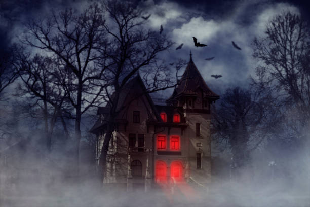 Haunted Halloween house Halloween creepy house with bats and red light from the windows, Halloween theme mythology photos stock pictures, royalty-free photos & images