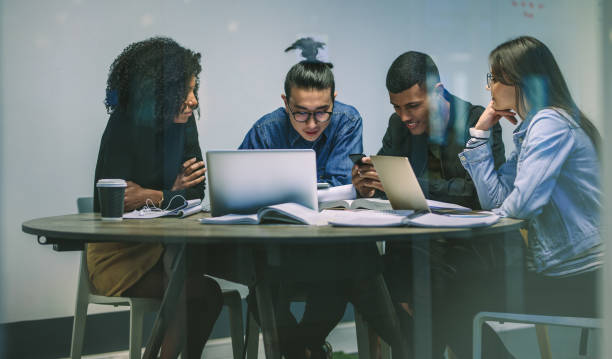 istock Multiracial group of young students using phones 1126082868