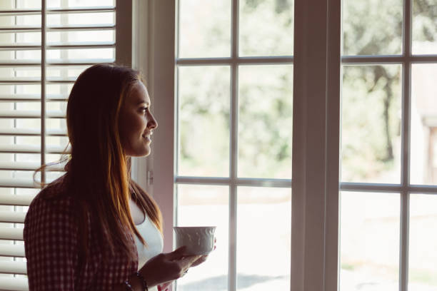 istock Girl drinking coffee in the morning 1126083109