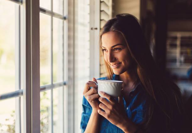 istock Relaxed woman at home drinking coffee 1126083110