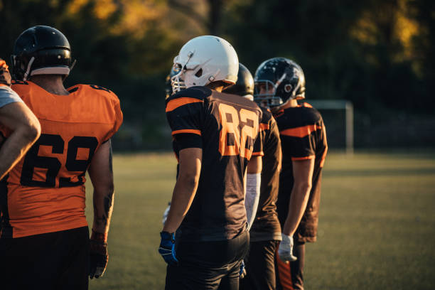 istock Football team on field 1126084250