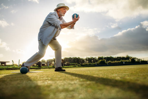istock Side view of an elderly man playing boules 1126086488