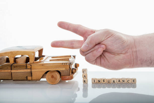 istock Wood car with hands, isolated photo 1126088388