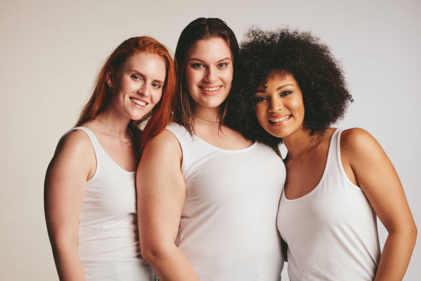 istock Group of different size women in white tank top 1126088564