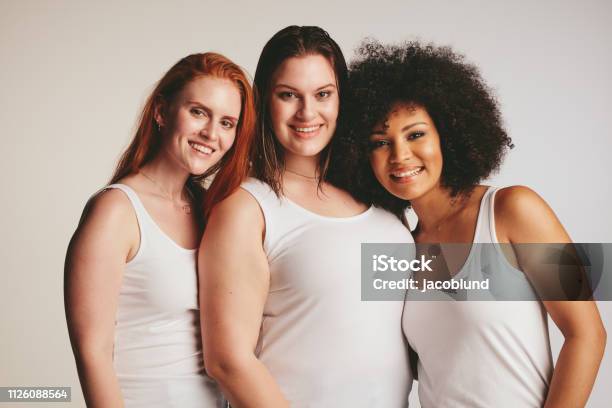 Group Of Different Size Women In White Tank Top Stock Photo - Download Image Now - Women, Only Women, Group Of People