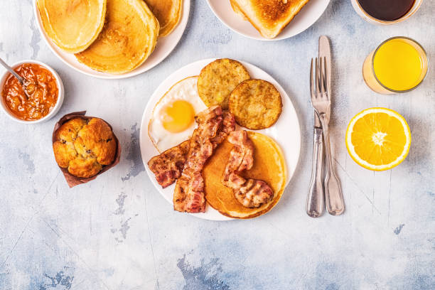 istock Healthy Full American Breakfast with Eggs Bacon Pancakes and Latkes 1126089743