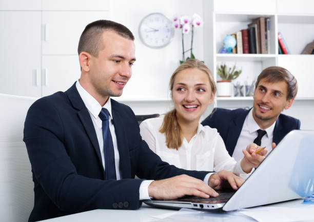 istock business colleagues with laptops in office 1126092754