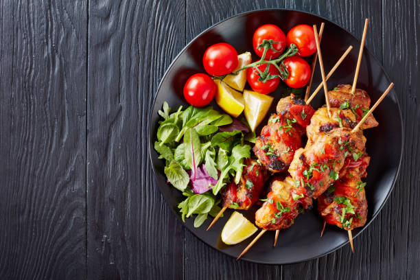 istock chicken kebab grilled on skewers, flat lay 1126093216