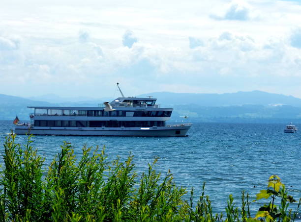 istock View from the green shore over the lake into the Alps with a passing ship 1126093385