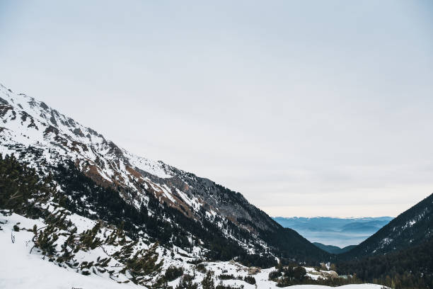 istock Mountains winter landskape, stone and trees 1126093521