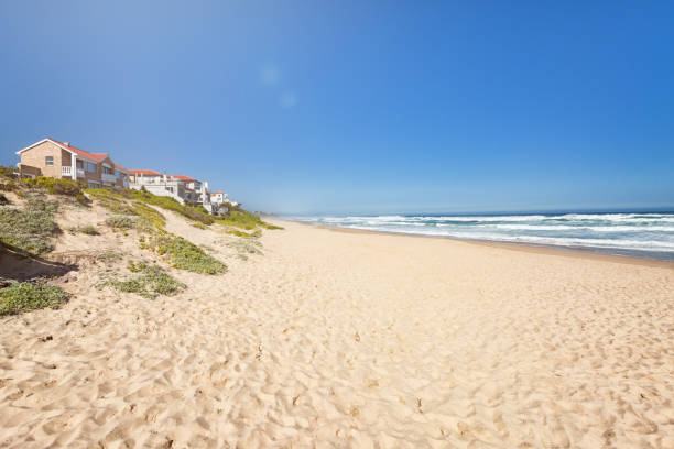 Beach bungalows at the city Wilderness, Western Cape South Africa Public beach. Loneliness ans solitude on a wide sand beach perfect for summer holidays in South Africa. Perfect starting point for whale tours. george south africa stock pictures, royalty-free photos & images