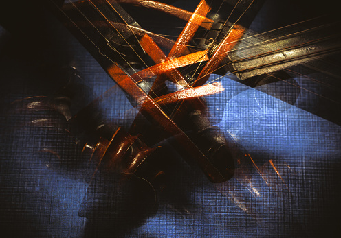 Abstract composition of an old violin, blended and accentuated shapes and textures of an instrument.