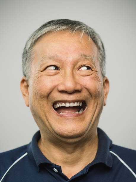 istock Real chinese senior man with excited expression looking to the side 1126095294