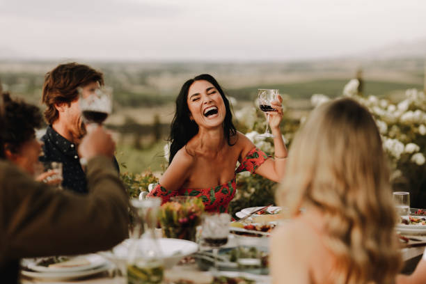 istock Group of people having great time at dinner party 1126096585