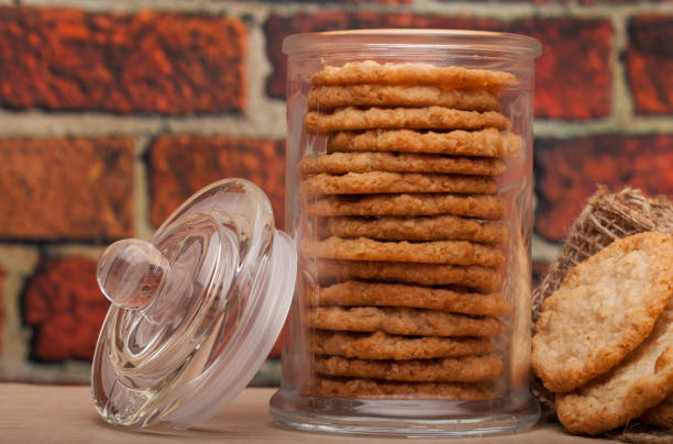istock Oatmeal cookies on the oak table, with brick wall 1126098152