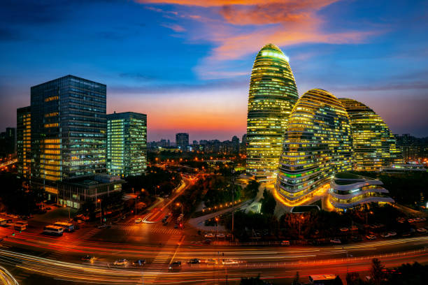 istock Traffic on the second ring road, next to building in city downtown at dusk 1126099581