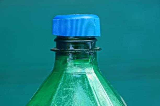 istock a portion of a large green plastic bottle covered with a blue stopper 1126100878