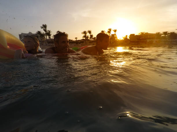 istock Family enjoying beach and sea vacations 1126101155