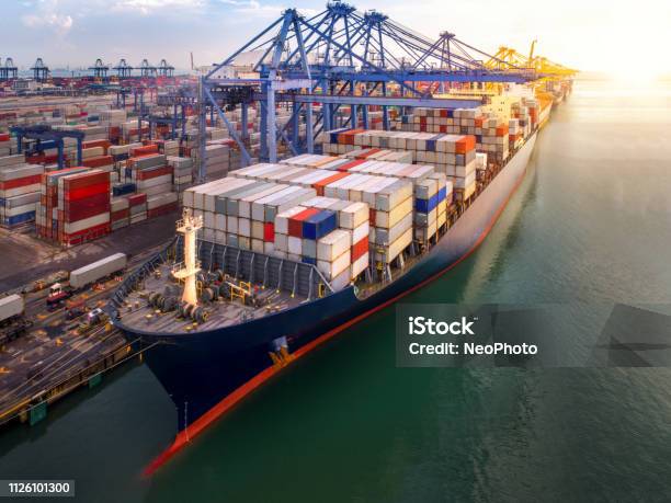 Container Port And Container Ship Transportation Stock Photo - Download Image Now - Freight Transportation, Harbor, Ship