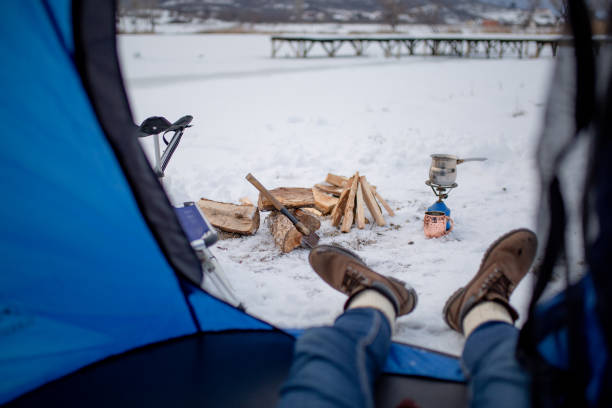 istock Couples camping in winter at the lake 1126101378
