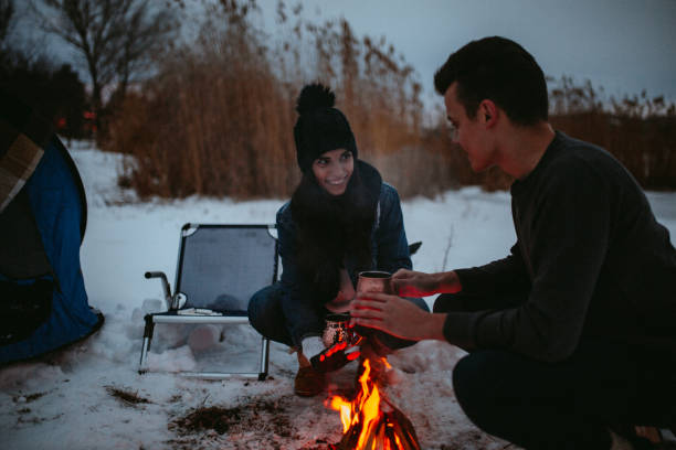 istock Couples camping in winter at the lake 1126101420