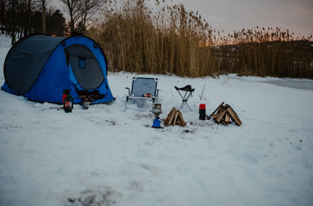 istock Couples camping in winter at the lake 1126102040