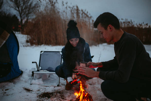 istock Couples camping in winter at the lake 1126102426
