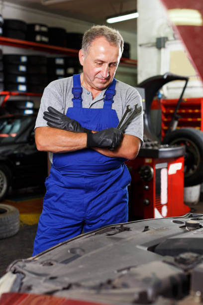 istock Skilled mechanic technician thinking about upcoming repair 1126103093