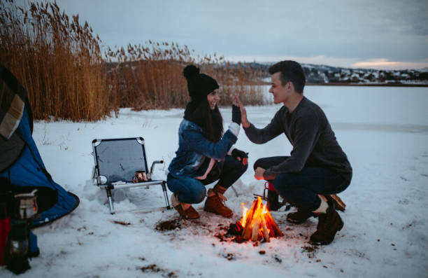 istock Couples camping in winter at the lake 1126103511